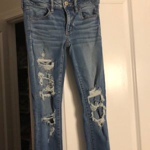American Eagle patched ripped jeans
